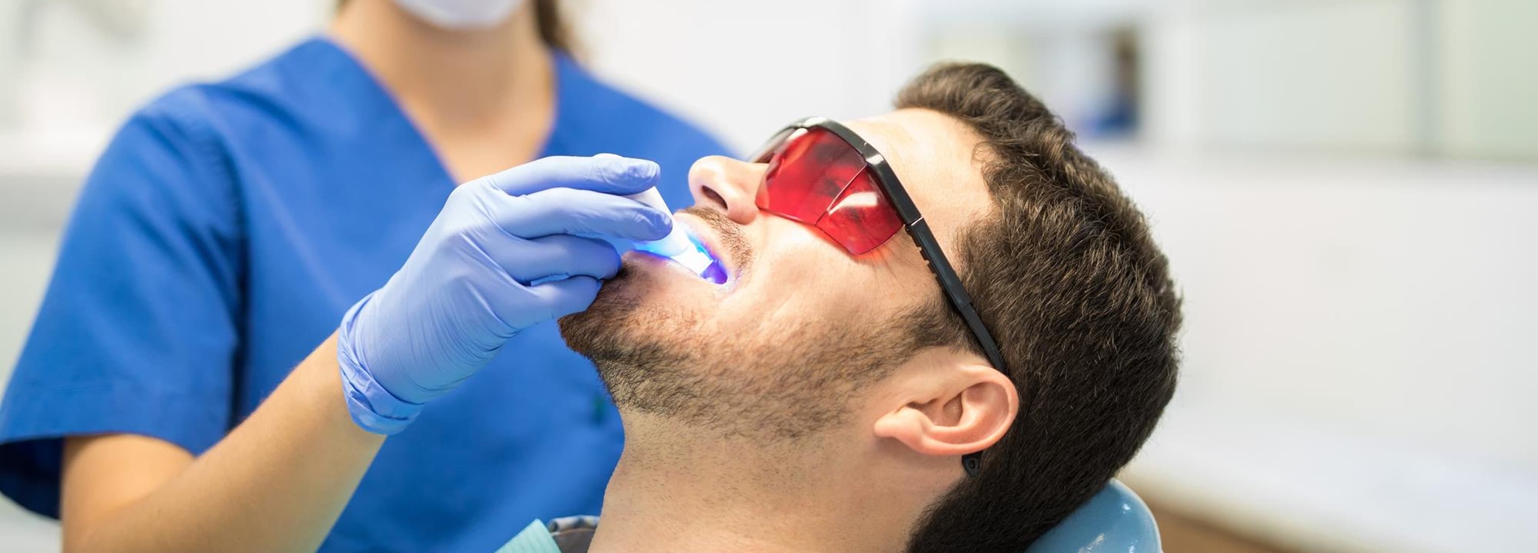 Patient having dental sealants set with a curing light