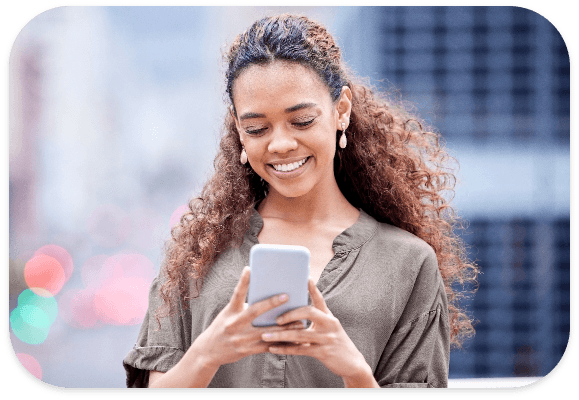 Smiling patient using a phone